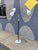 Striking vintage mid-century modern three-arm floor lamp featuring a sculptural atomic-era silhouette with adjustable cone...