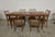 Sculptural table and six chairs by pierluigi colli. elegant oak table with turned legs carved with high reliefs depicting...