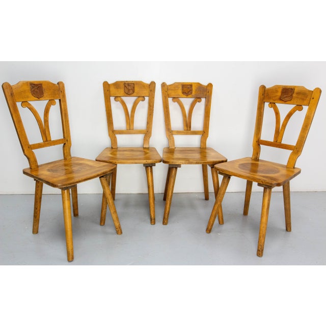 French set four chairs made in oak circa 1960. The shape of the chairs are inspired by the lines of art nouveau. On the...