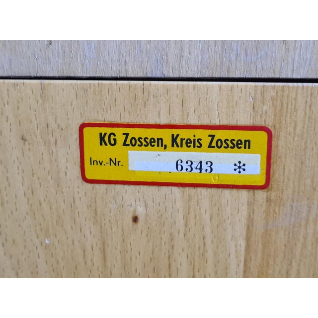 An original wooden catalog cabinet from a German institution in Zossen, featuring its original inventory label reading “KG...