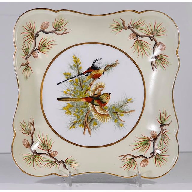 A pair of one-of-a kind decorative pinecone/bird plates. Showroom Samples, beautiful motif featuring birds with pinecone...