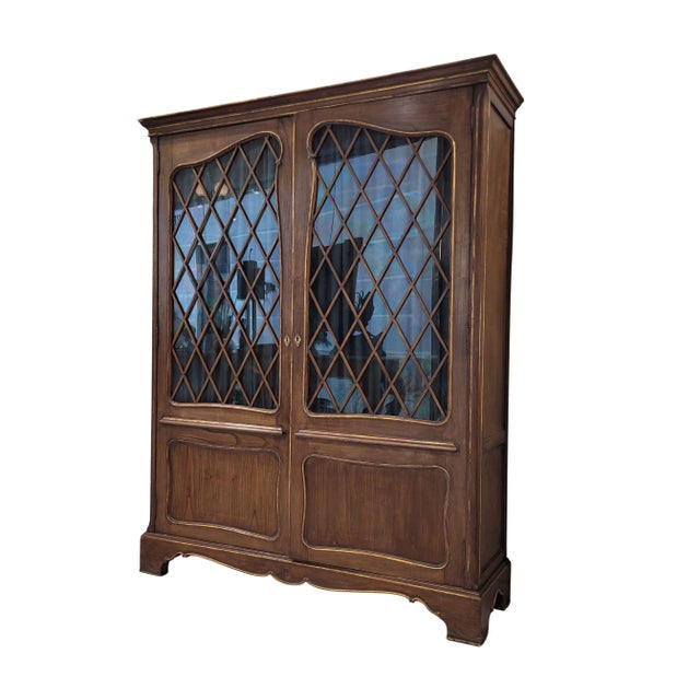 This Art Nouveau cabinet, made of stained and gilded pine, dates from the first quarter of the 20th century and reflects...