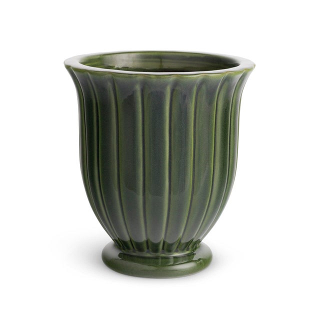 This durable earthenware pot is designed for the outdoors, but is equally as beautiful indoors. From the depth of the...