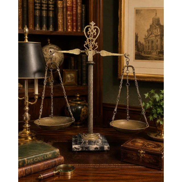 A striking large-scale Italian decorative balance scale crafted in brass with an elegant carved marble base. Made in Italy...