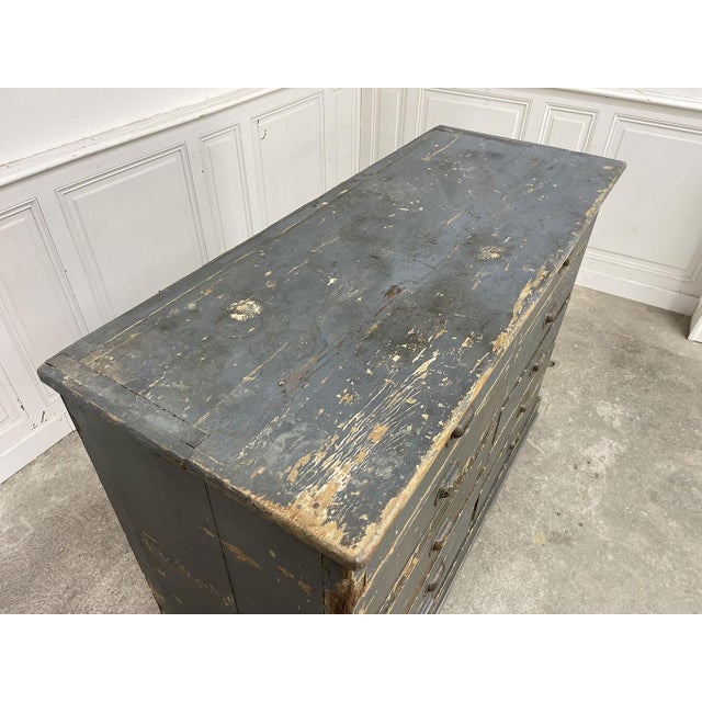 Ten drawers with elegant cast-iron shell handles adorn this 1930s workshop cabinet, fully restored by us! This superb...