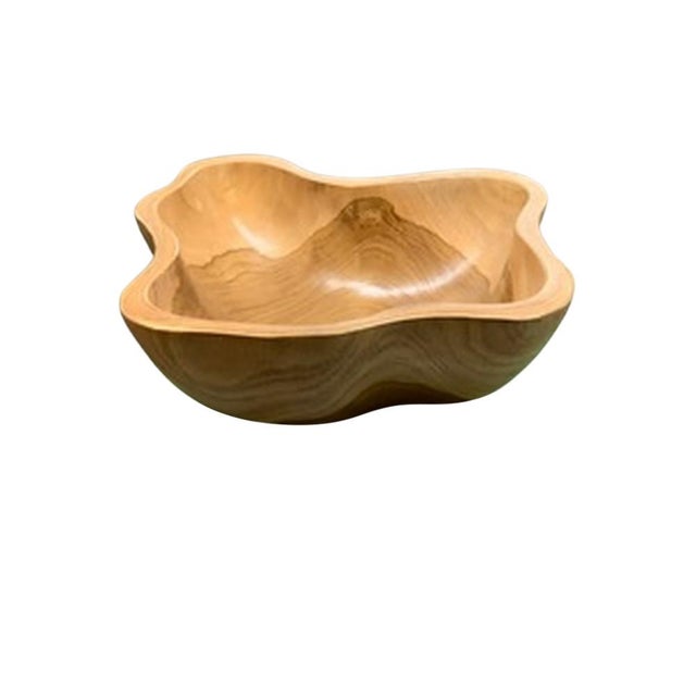 This teak live edge bowl is a unique piece showcasing the natural beauty of teak wood. Crafted by skilled artisans, its...