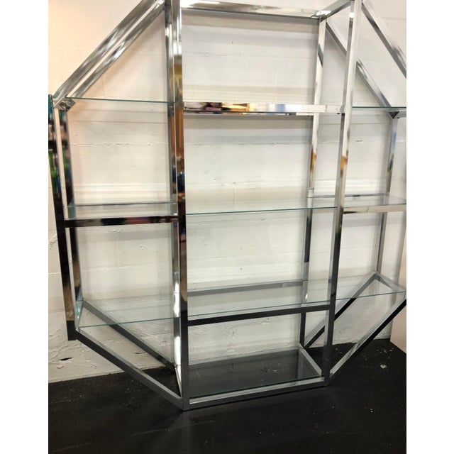 Unique display solution for all your wares. Octagonal chrome etagere with 3 long glass shelves and one small shelf for the...