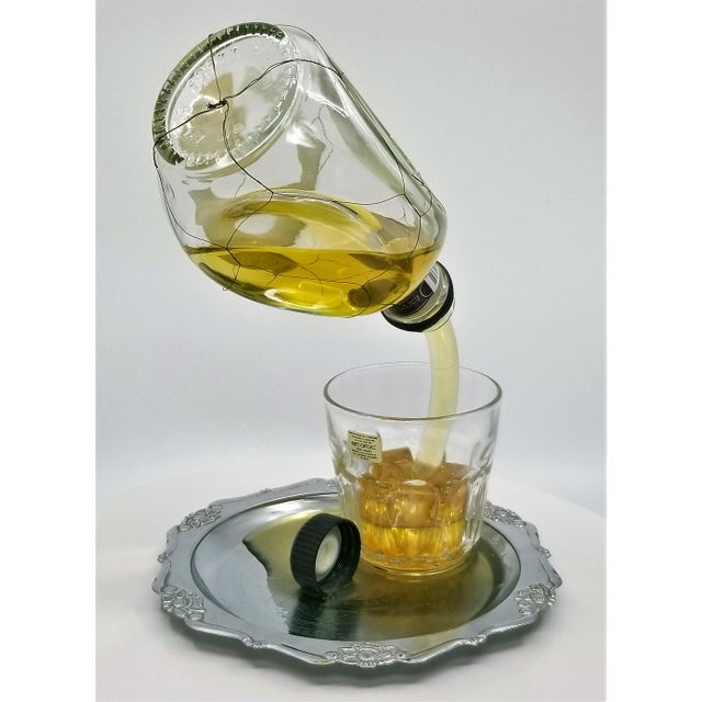 Pop Art Sculpture of Pinch Liquor Bottle Pouring a Drink Designed by