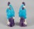 A pair of Chinese export porcelain roosters perched on a rocky plinth with one leg raised, the bodies glazed in turquoise,...