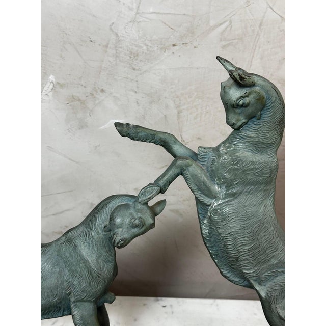 An elegant 1930s animal sculpture depicting two kids at play, captured in a lively and natural movement. One rears up...