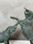 An elegant 1930s animal sculpture depicting two kids at play, captured in a lively and natural movement. One rears up...