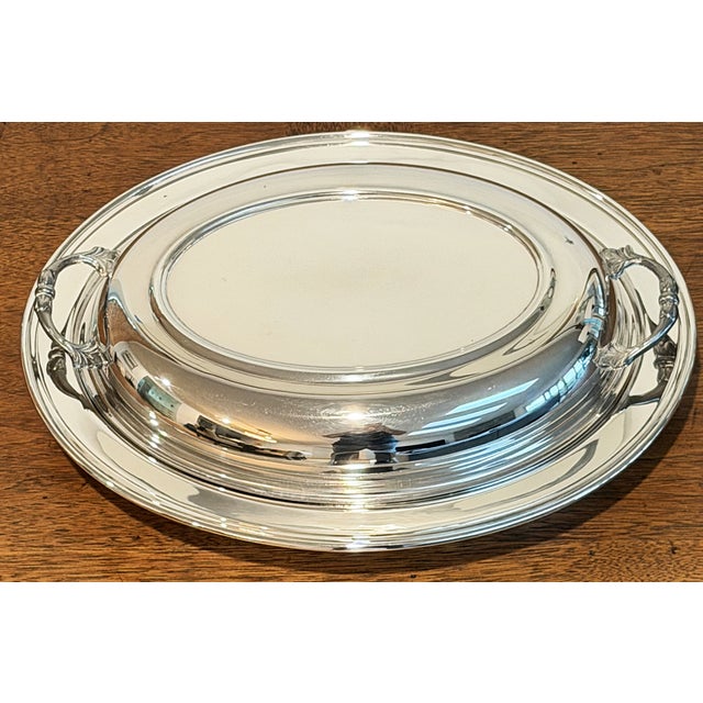 This is a silver-plated server with a lid made in the US by the Sheffield Silver Company. It was likely produced in the...