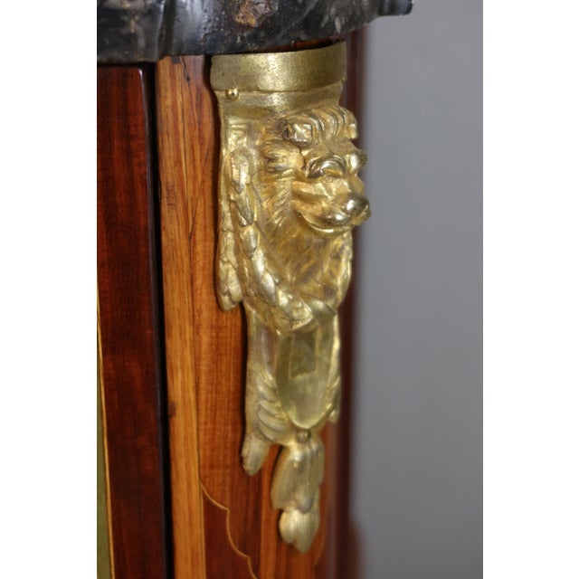 A Transition period commode from the 18th century, crafted from marquetry wood and stamped by Martin Ohneberg, born in...