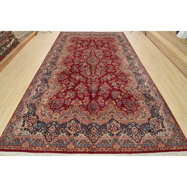 An authentic vintage traditional Kerman rug hand-knotted with fine wool and natural dyes. This oriental rug features a...