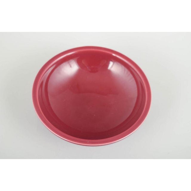 Wilhelm Kåge for Gustavsberg Bowl, mid-20th century. Rare bowl in red glaze, with a low foot and refined, minimalist form....