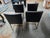 Set of 4 dining chairs in leather and brass tone frames by Restoration Hardware.