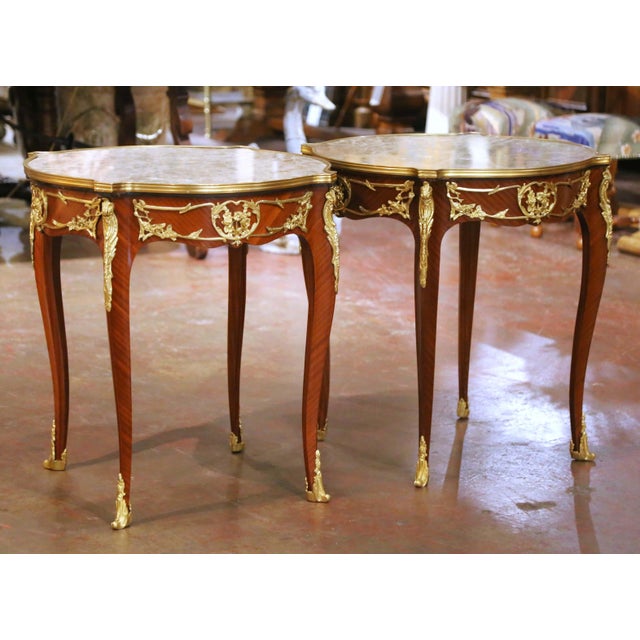 Decorate a living room, bedroom, or seating area with this elegant pair of antique Louis XV style side tables. Crafted in...