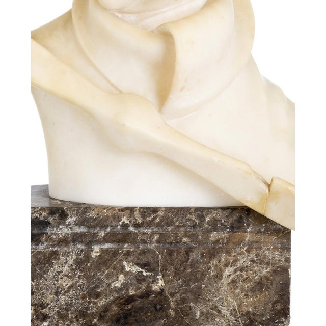 Sculpture - Amelia Earhart. Bust of the famous aviator in alabaster. Set on a marble base. Defect in the propeller....