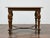 A 19th-century Italian walnut side table showcasing refined craftsmanship and decorative detail. The rectangular top is...