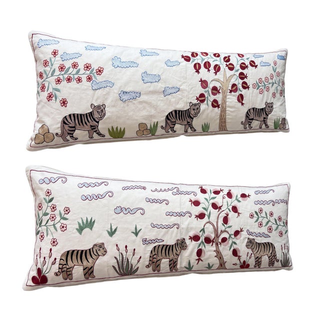 This beautiful 18'' x 54'' hand-embroidered Suzani pillow cover set was made from authentic Uzbek cotton fabric. The...