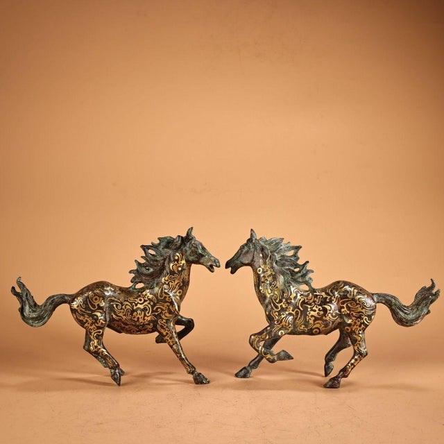 This is a dynamic pair of vintage Chinese bronze sculptures depicting galloping horses. Crafted from solid copper/bronze,...