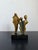 Abstract modern bronze sculpture of three people on black granite base, Brazil 1980s. Artist unknown.