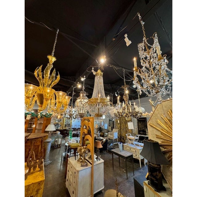 This 19th century French Empire bronze and crystal basket chandelier exudes elegance and sophistication. With its gorgeous...
