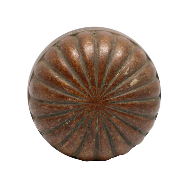 This radial design knob was made by Enoch Robinson. It is part of the L-15120 group. It is made of bronze in an antique...