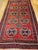 This vintage Afghan Tekke Bokhara rug, woven in the second quarter of the 20th century, embodies the rich tribal artistry...