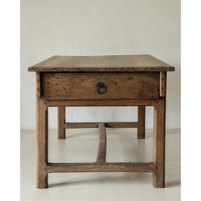 Beautiful oak table, recovered in France and dating back to the 19th century. A large drawer on one of the short sides.