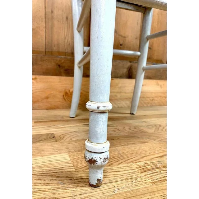 Charming Louis 16 style chaise longue in light grey patinated wood. The cane seat is painted with diamond patterns. France...