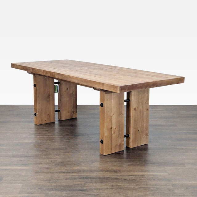 Recycled wood table in a natural finish with metal hardware. With the leaf, the table extends to 100 inches and seats 8....