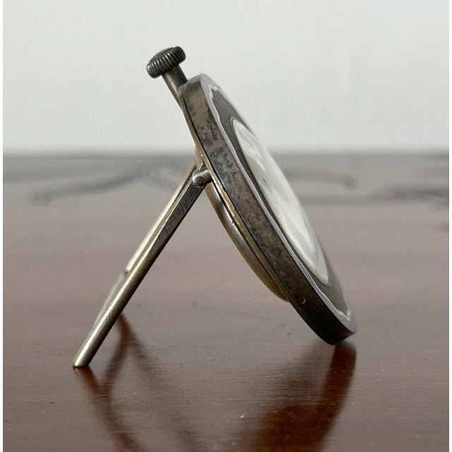 Cyma - Art Deco Table Clock with Enamels, 1920s-1930s Shaped gilded metal case with blue, black, and white enamel edges....