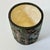 This is a fun jungle motif ceramic planter. It features birds and apes among jungle foliage and trees. The photography...