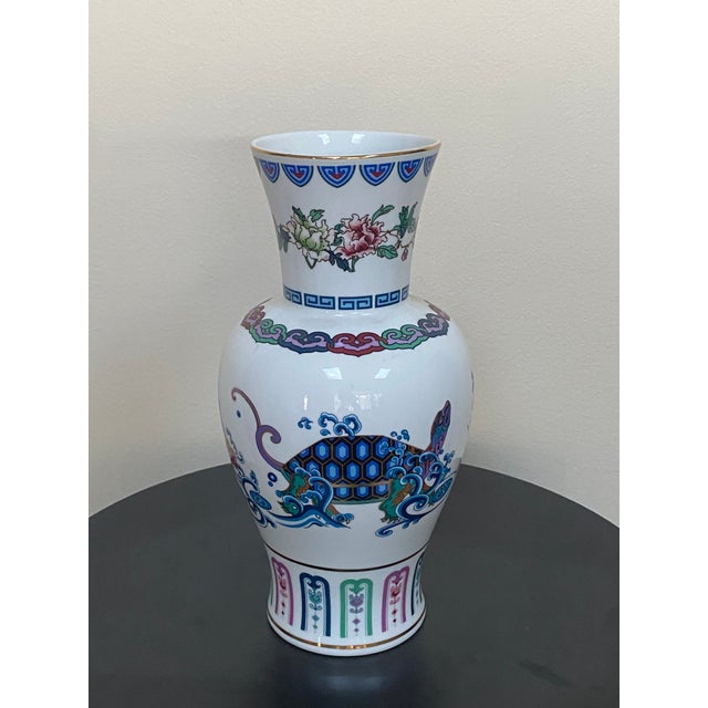 A 1986 Franklin Mint fine porcelain vase titled The Journey of the Heavenly Tortoise, featuring an elaborate turtle motif...