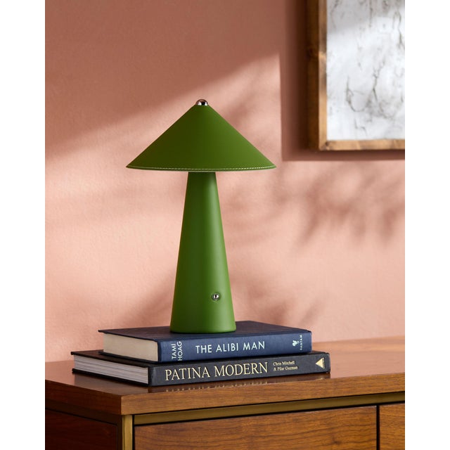 Illuminate your space with a touch of retro flair with the Nomelle accent table lamp. Standing at a charming 12 inches...