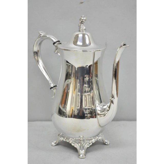 Vintage Oneida Victorian Style Silver Plated Victorian Teapot Coffee Pot. Circa Mid 20th Century. Measurements: 10.5" H x...