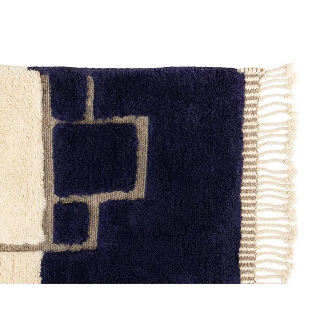 Stunning hand-knotted wool rug with an abstract pattern in Navy Blue and Ivory, accented by hand-woven Misty Taupe lines,...