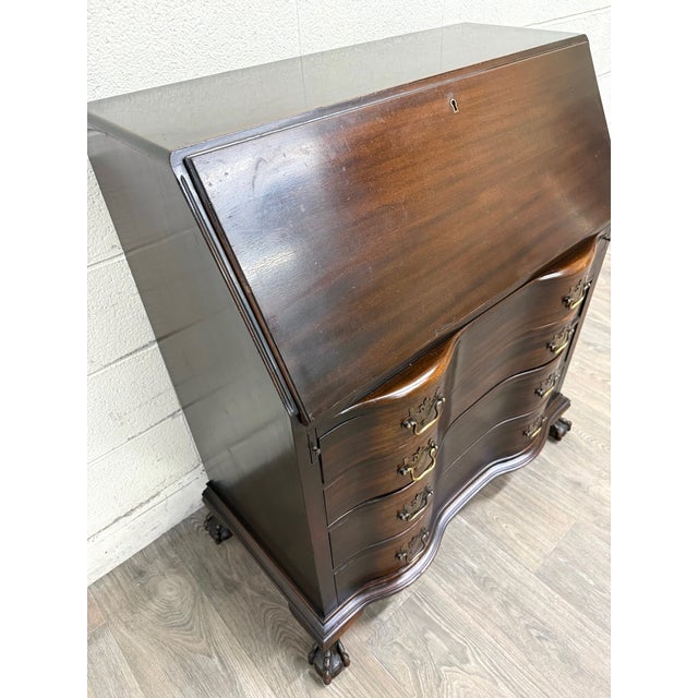 This is a gorgeous vintage, possibly antique, Chippendale style fall front or drop front secretary desk with elements of...