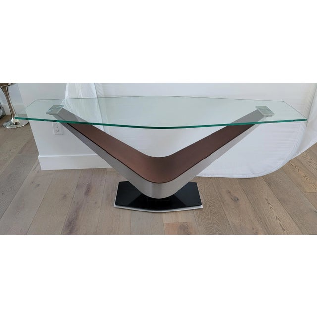 Large Contemporary modern console table with thick glass and a chrome and wooden frame. Tehe chrome block accents hold up...