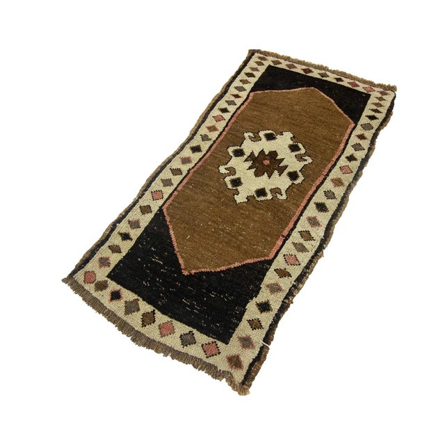 Vintage Handknotted decorative mini rug from Kars region of Turkey. Approximately 45-55 years old. In very good condition.