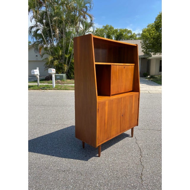 Danish Teak Veneer Bookcase with Lockable Pull-Down Secretary Storage. Open Cubby Shelving with One tall shelf. Two...