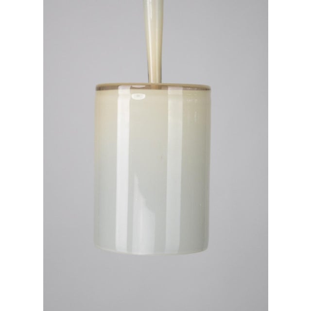 Contemporary style Pendant, Satin brass, Vanilla Hand crafted glass, D200xH615mm, 1xE27 This piece has an attribution...