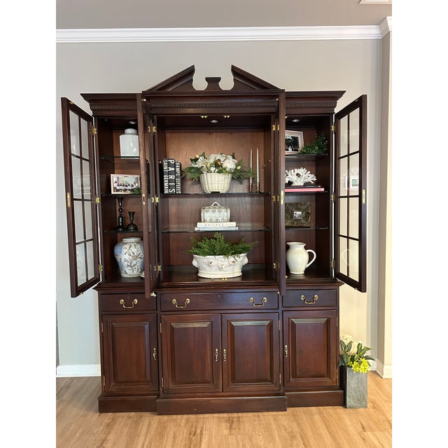Beautiful solid wood Lexington china cabinet with glass display doors and built-in lighting. Classic traditional style...