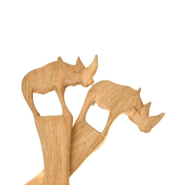 Wood grain will differ with each set of spoons. Yours will be similar. A set of wood hand-carved spoons. Made throughout...