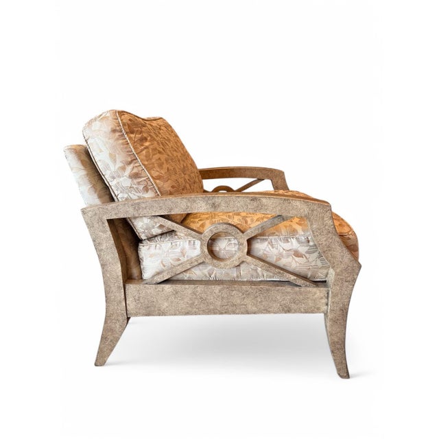 Pair of lounge chairs by designed by Erwin Lambeth for Tomlinson. The deep chairs have a cross-and-circle detail on the...