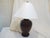 This 19th Century bronze vase, made into a lamp with a hardwood base, is shown with an 18"Diameter white paper shade. The...