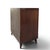 A vintage two-door storage cabinet with dramatic, mirror-matched flame-pattern mahogany veneers. Framed door panels, a...