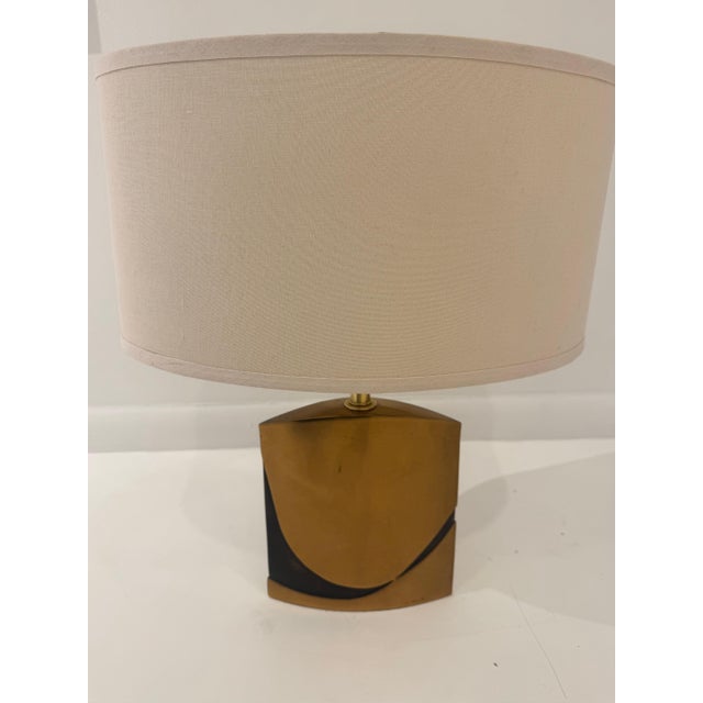 A wonderful heavy cast bronze sculptural eclipse shaped table lamp designed by Esa Fedrigolli. Signed. Rewired with an...