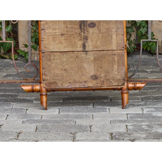 This French faux bamboo mirror from circa 1900 captures the enduring appeal of colonial and campaign-style design with its...